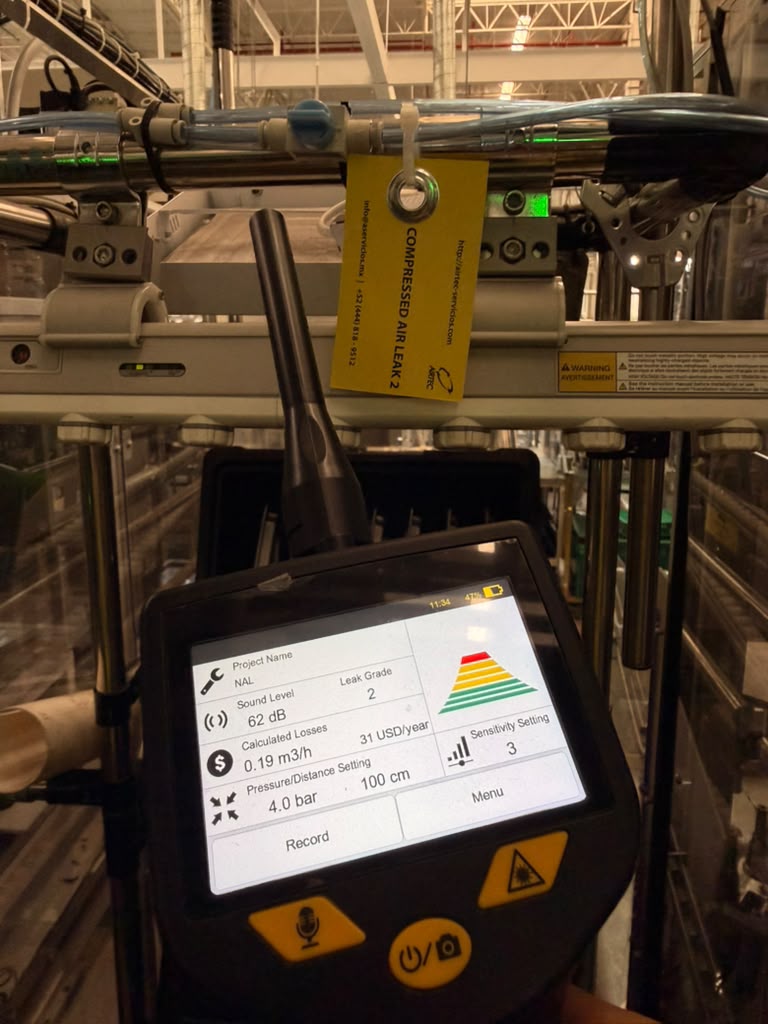 Auditor inspecting pneumatic connections with SUTO iTEC S531 ultrasonic detector